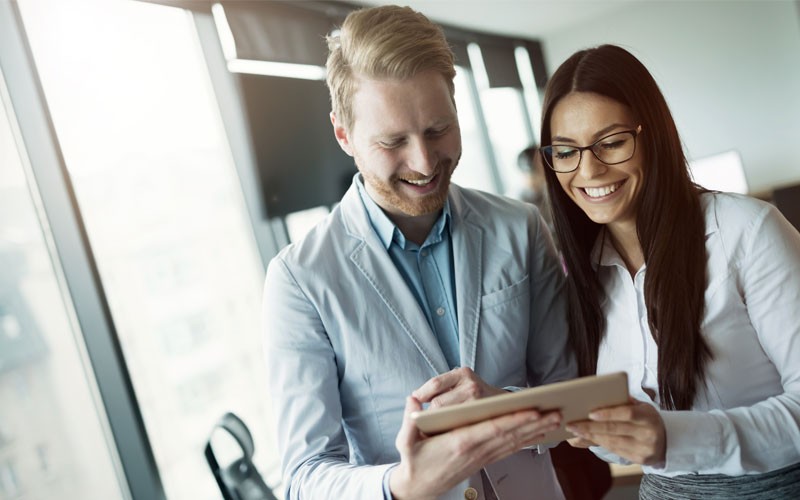 We can even help you ensure your data is secure Professionals using tablet computer to look up technology products for purchase
