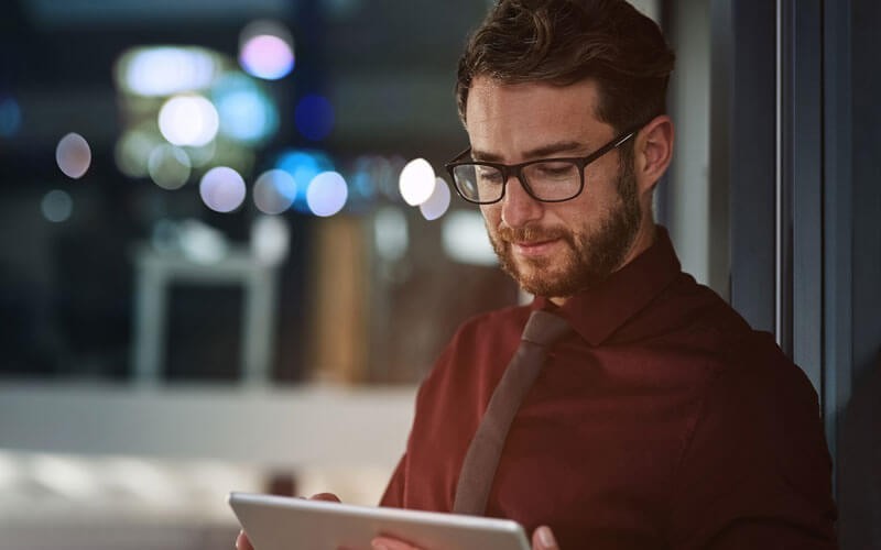 Business man on tablet mobile device