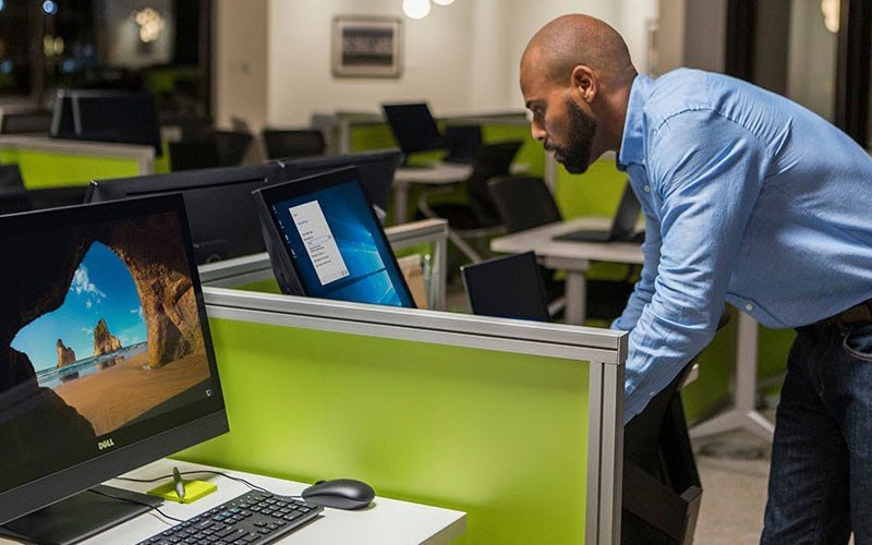Dell employee working on workstations