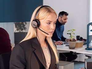 Young female worker concentrates during a call