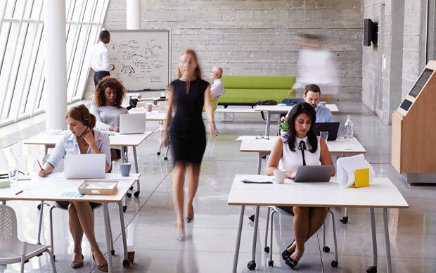 Woman walking through an open plan office