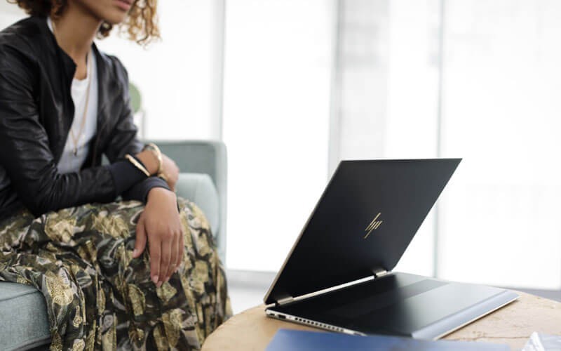 HP convertible and detachable models HP convertible notebook in office with female user