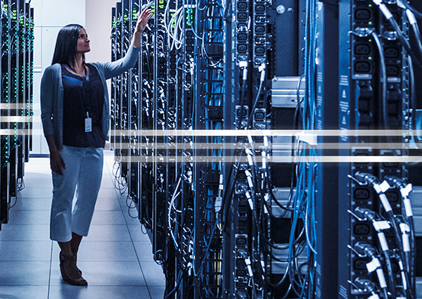 Woman in server room checking something