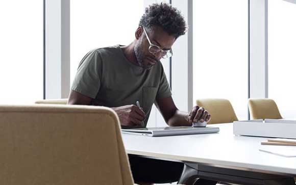 mobile device user in boardroom